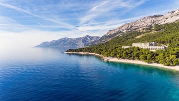 отели вблизи пляж Punta Rata Gen брела онлайн заказ на